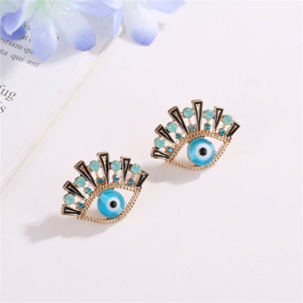 2025/03/1000303560.jpg Aretes ojitos azules